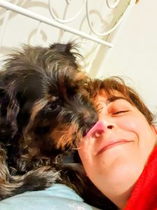 Cookie gives a gentle nose kiss showing quiet emotional support and love in the Guardian Paws category.